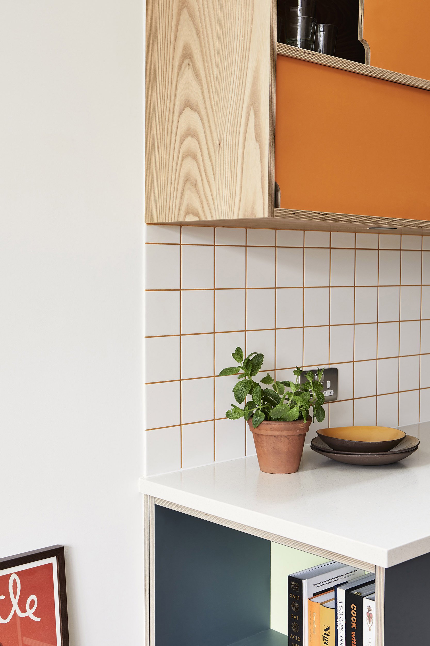 open book shelf at the end of the kitchen run in matt laminate on plywood