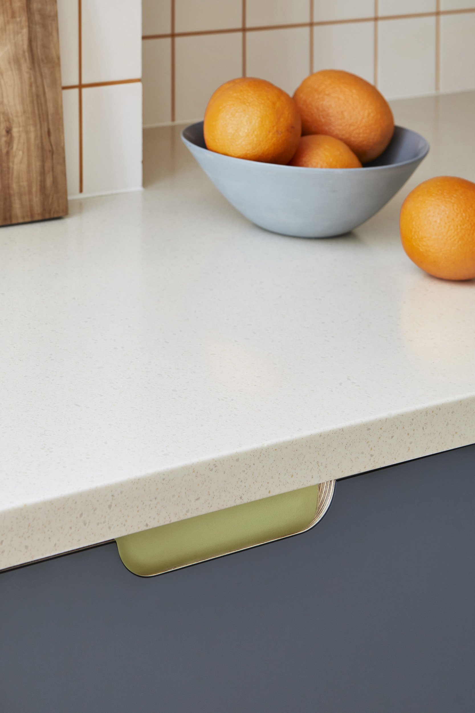 matt blue fronts with green handle detail