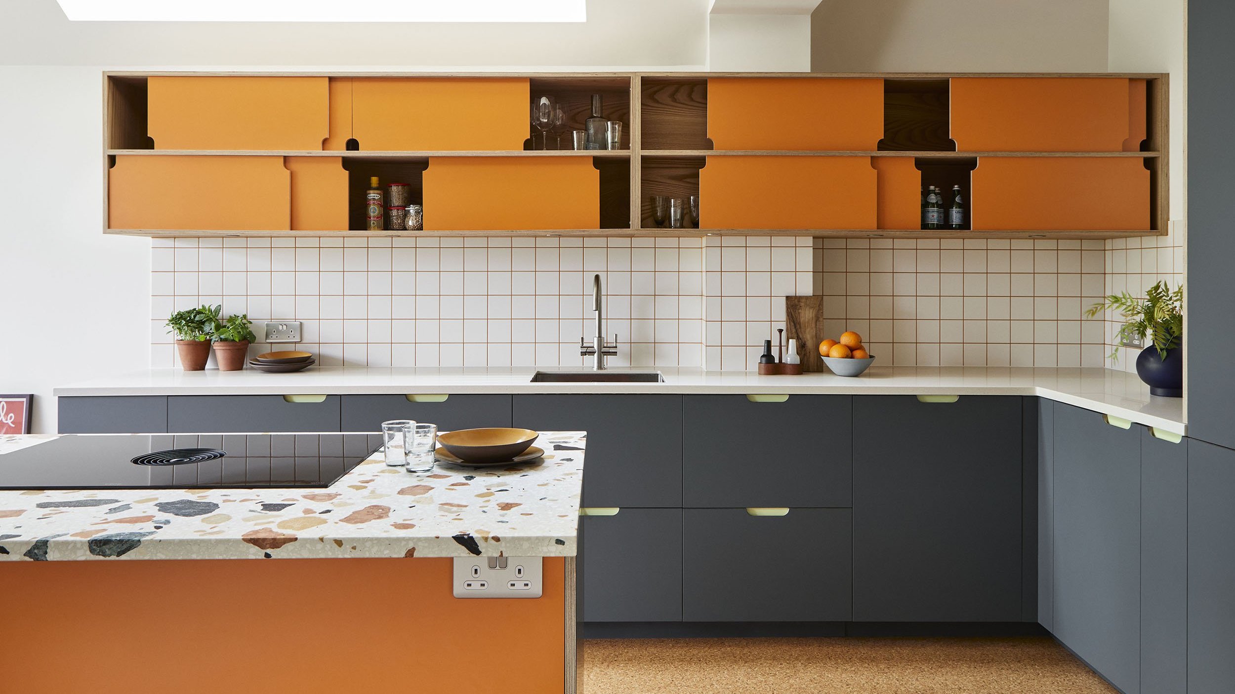 matt blue kitchen fronts plus orange wall cabinets