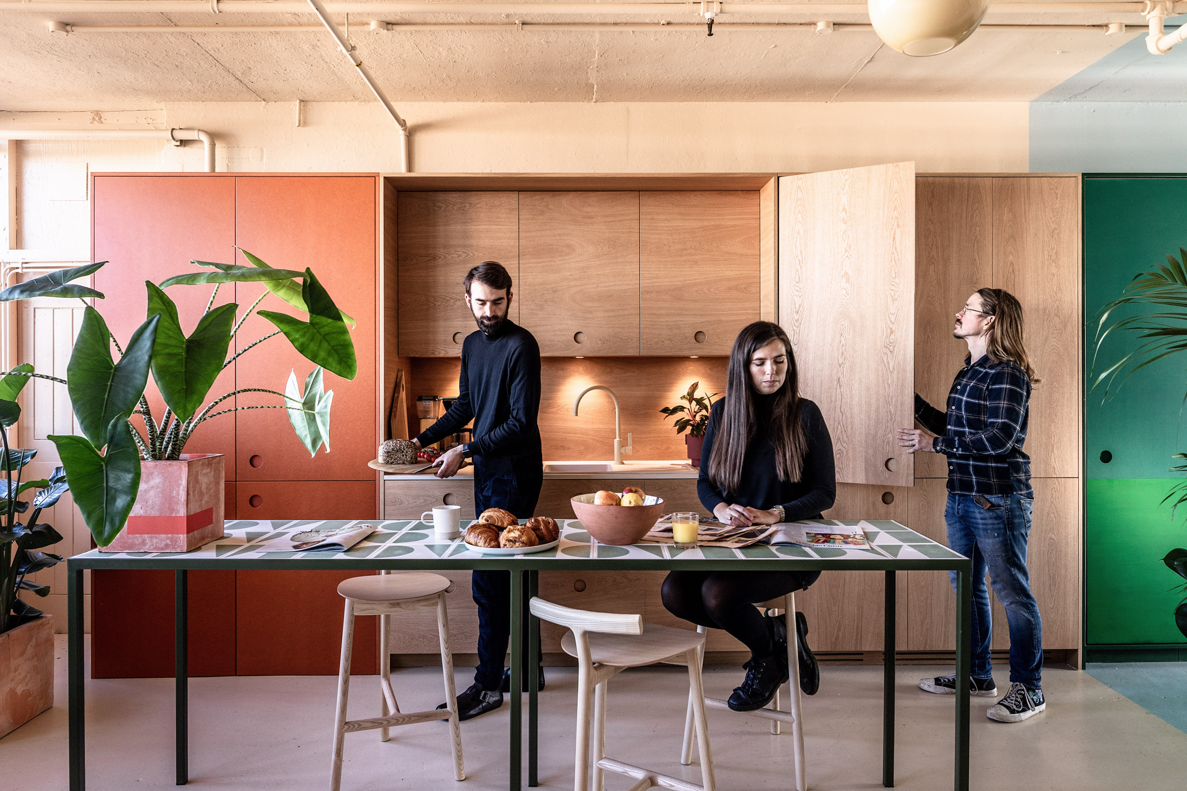 Four people in kitchen