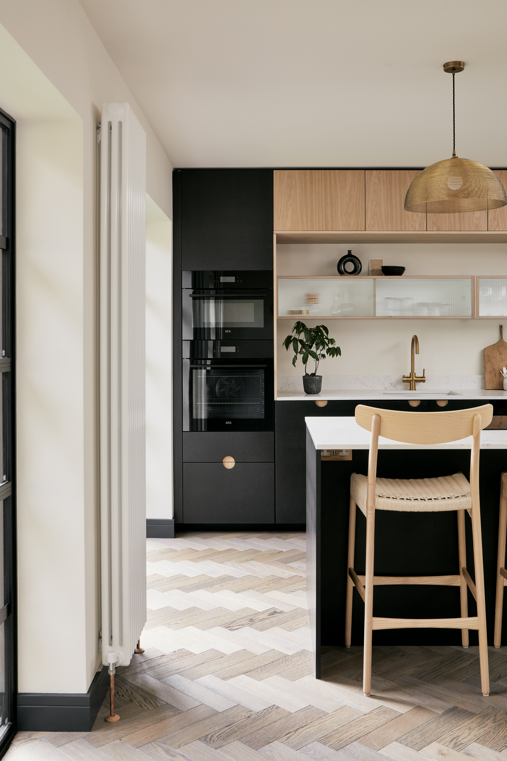 Black kitchen and wooden chair