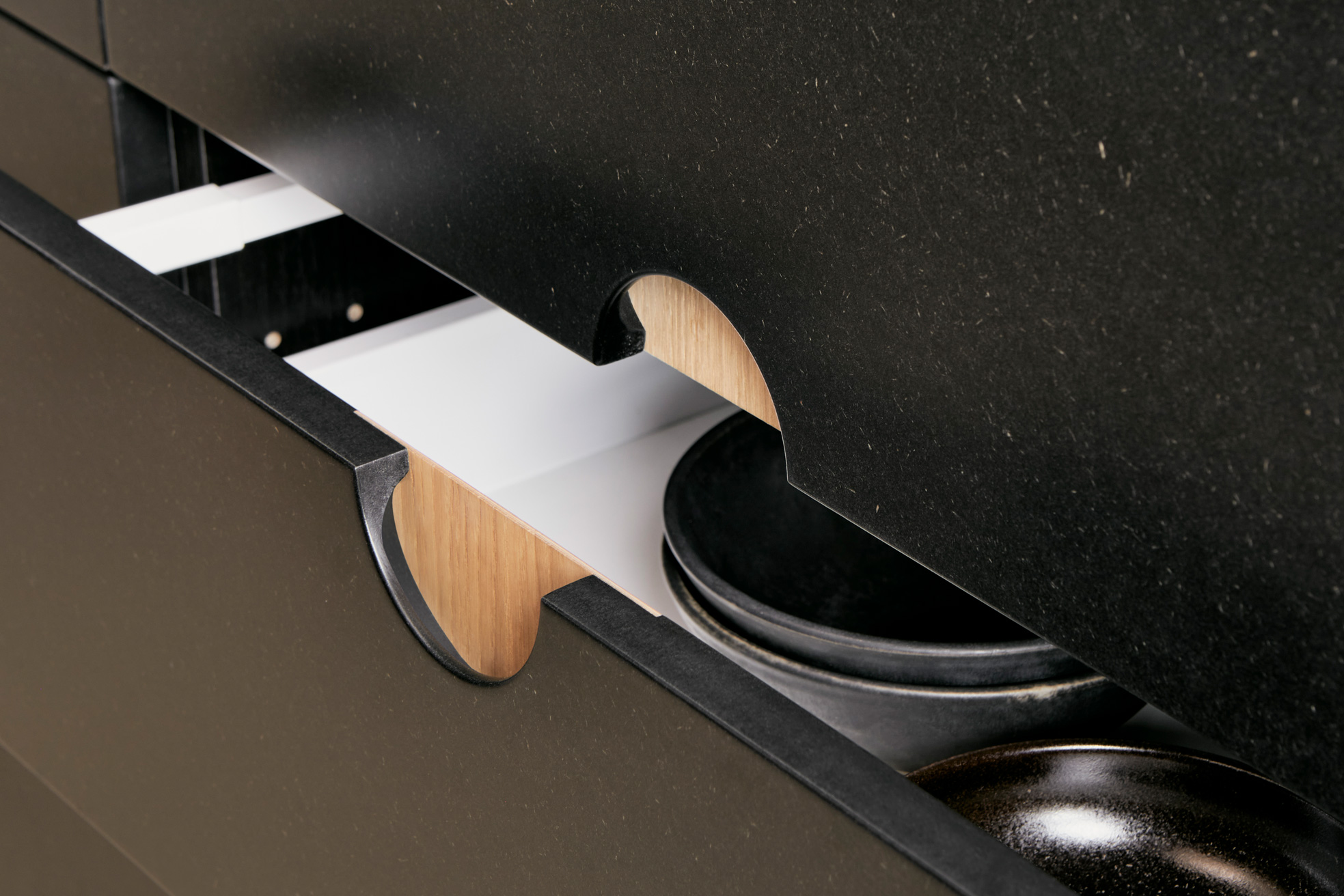 black drawer with wooden pull handle
