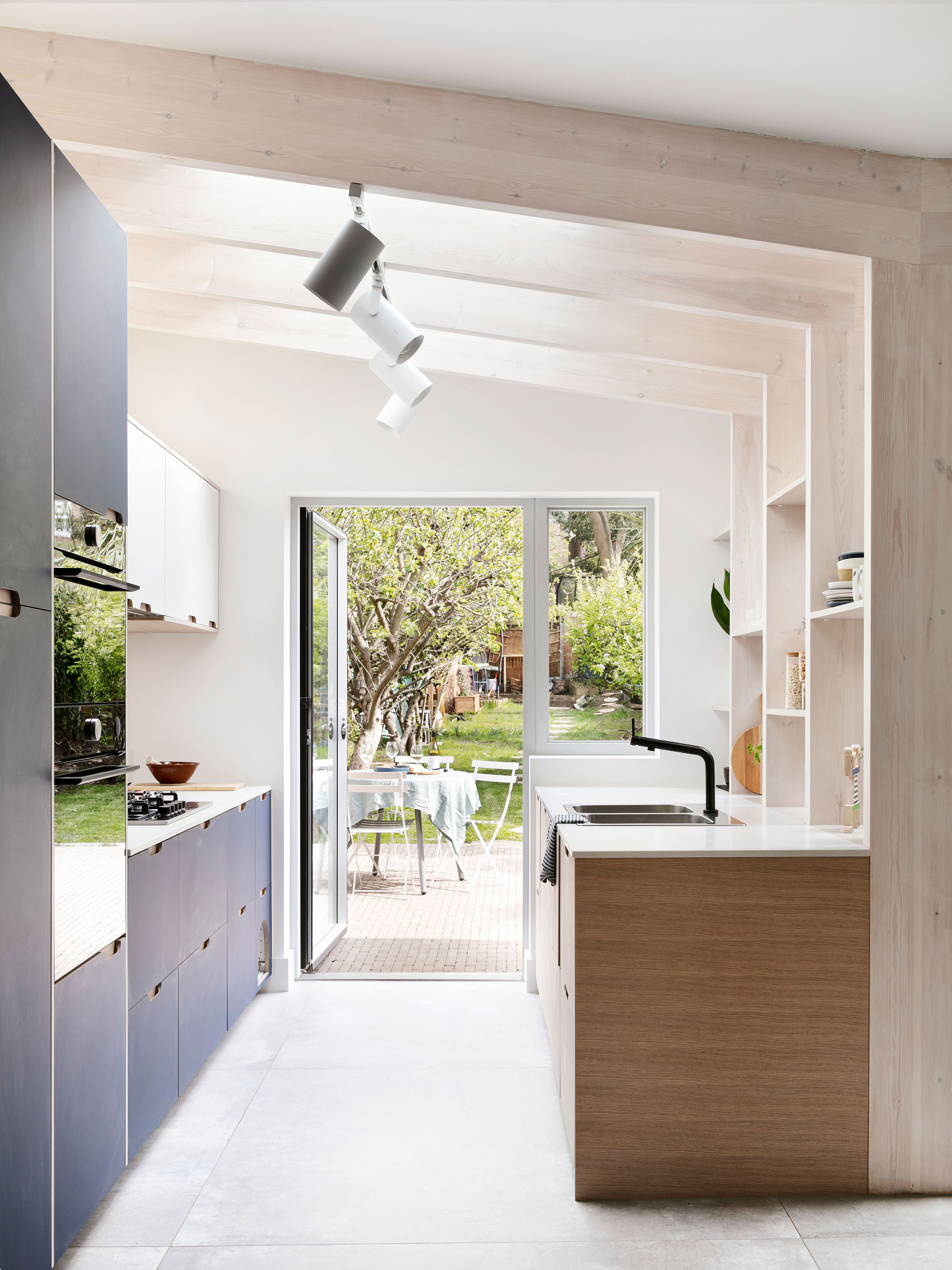 Blue kitchen view to garden