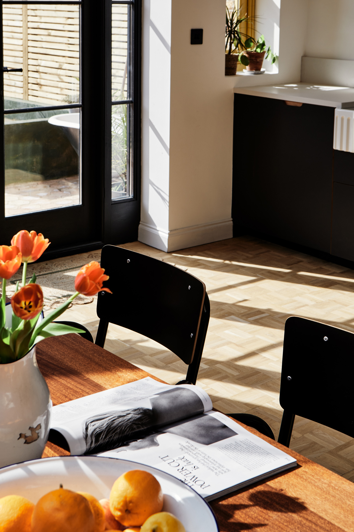 black chairs with sunlight on wooden floor