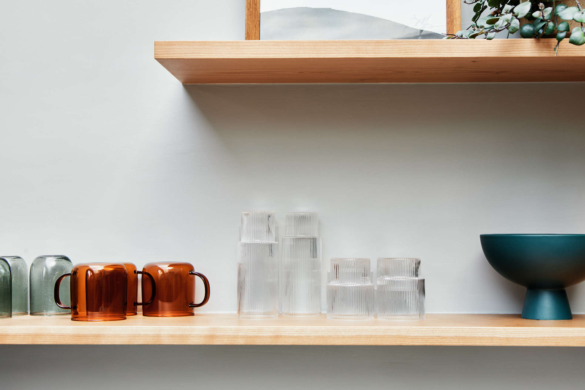 open wooden shelving with glasses ontop