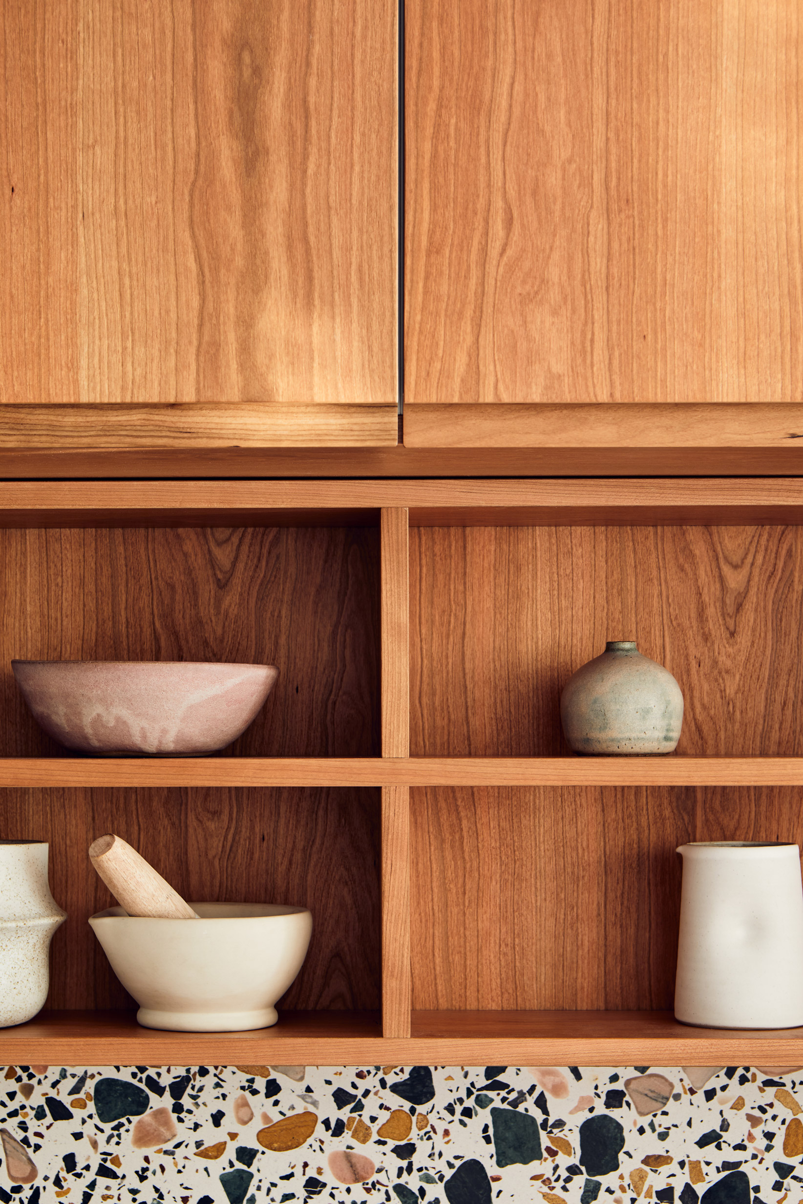 open wood shelves with vases