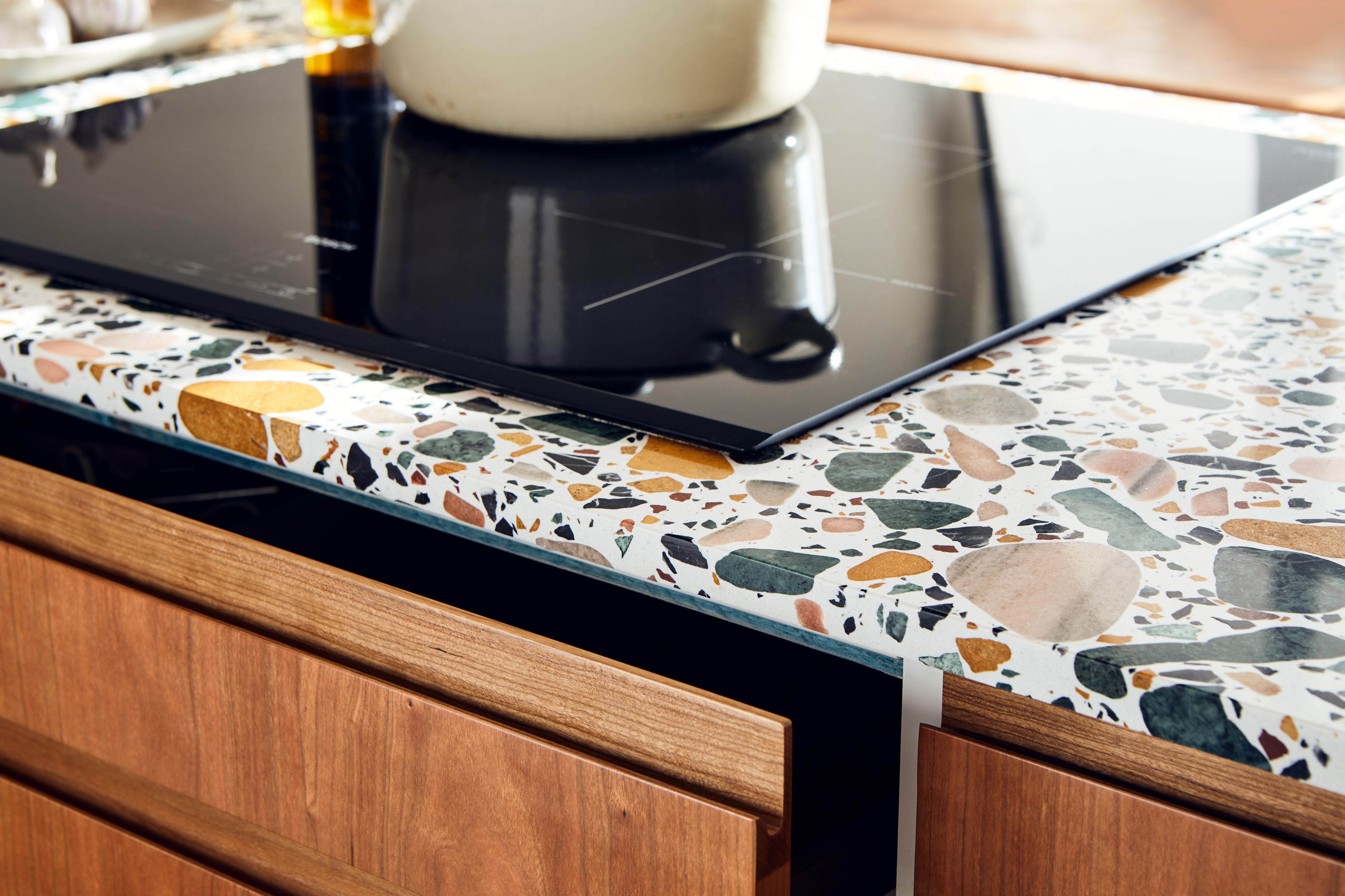 hob on worktop with open wooden drawer