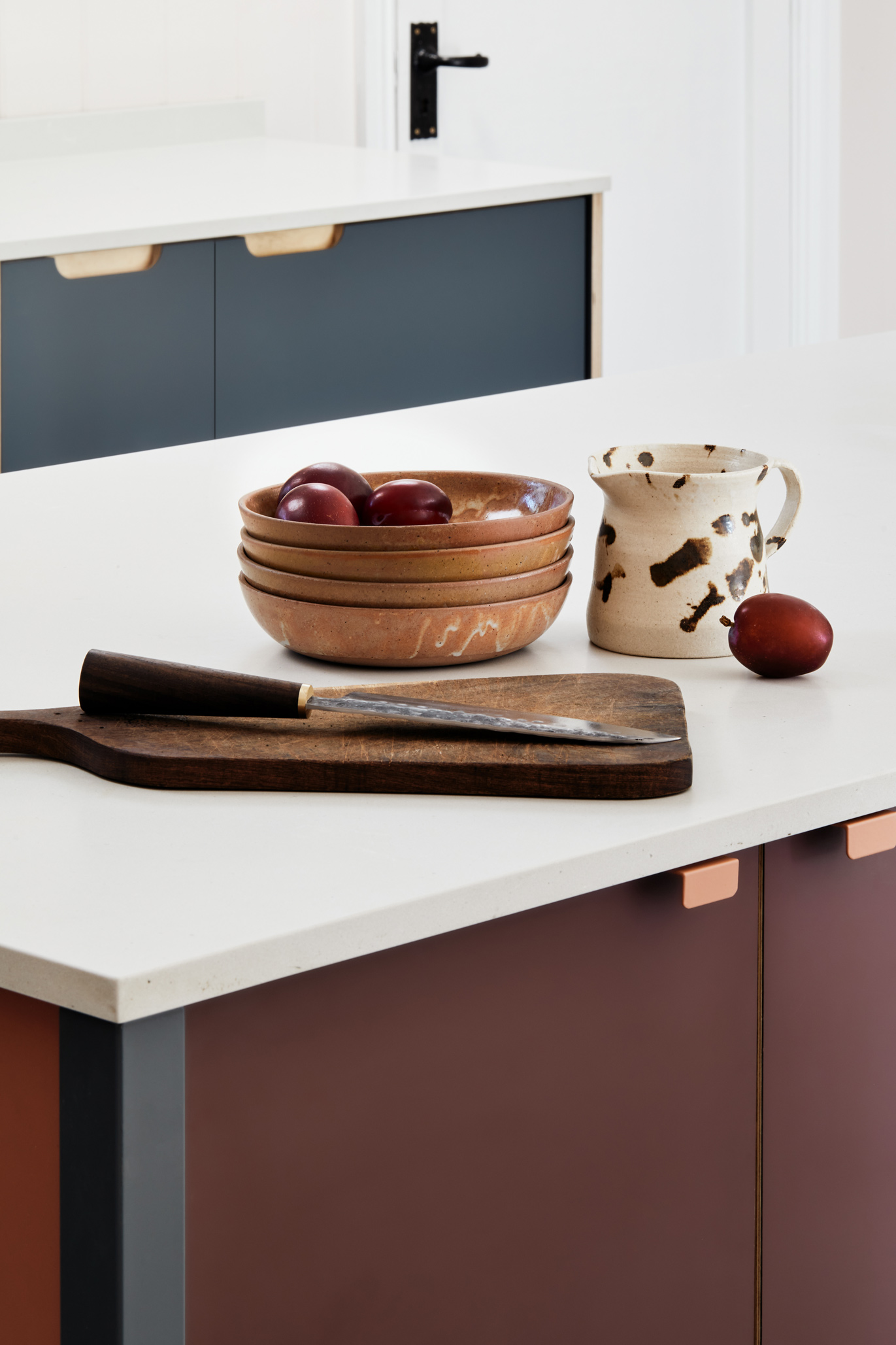 Terracotta and stone blue kitchen and white worktop