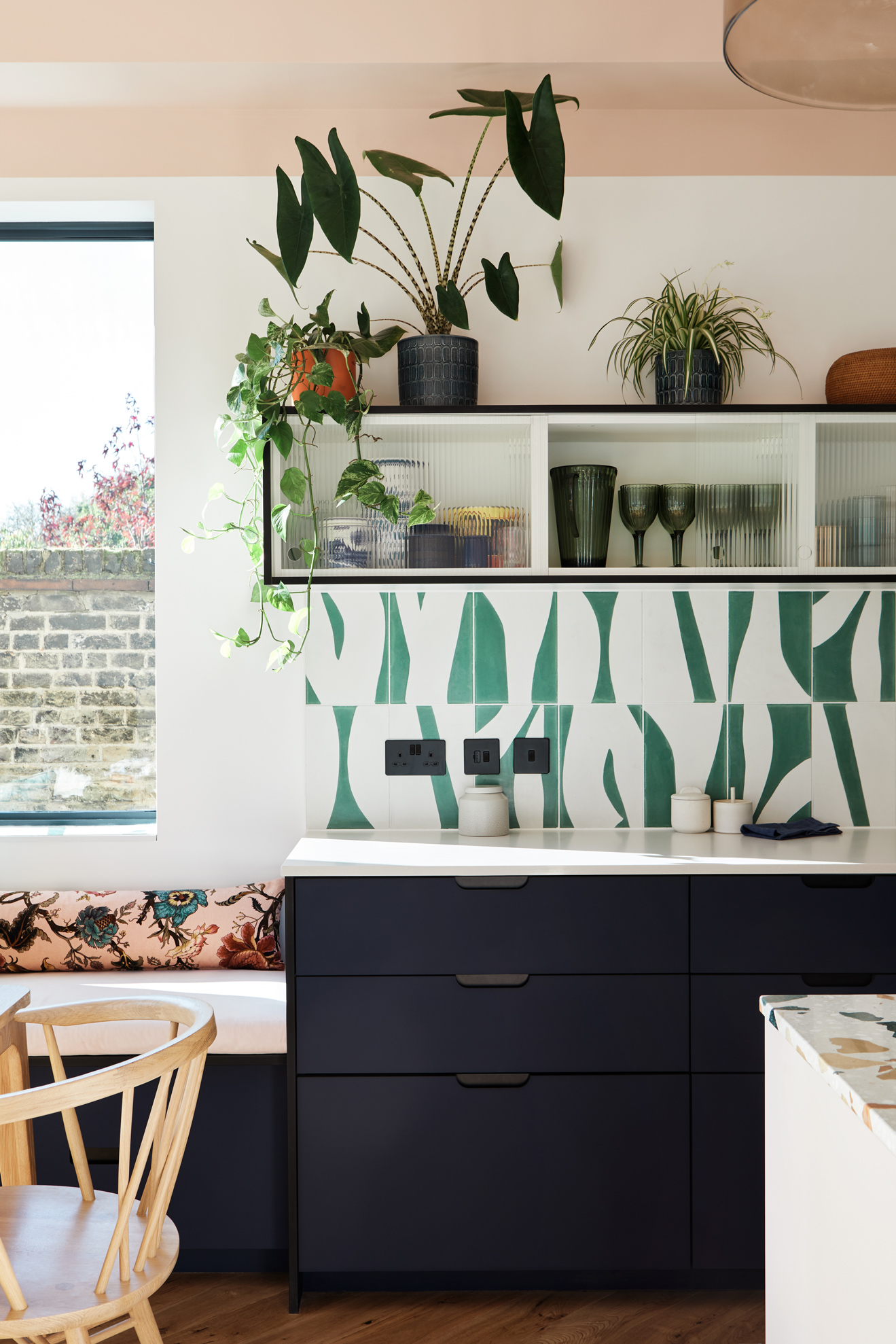 Blue and teak kitchen with white worktop