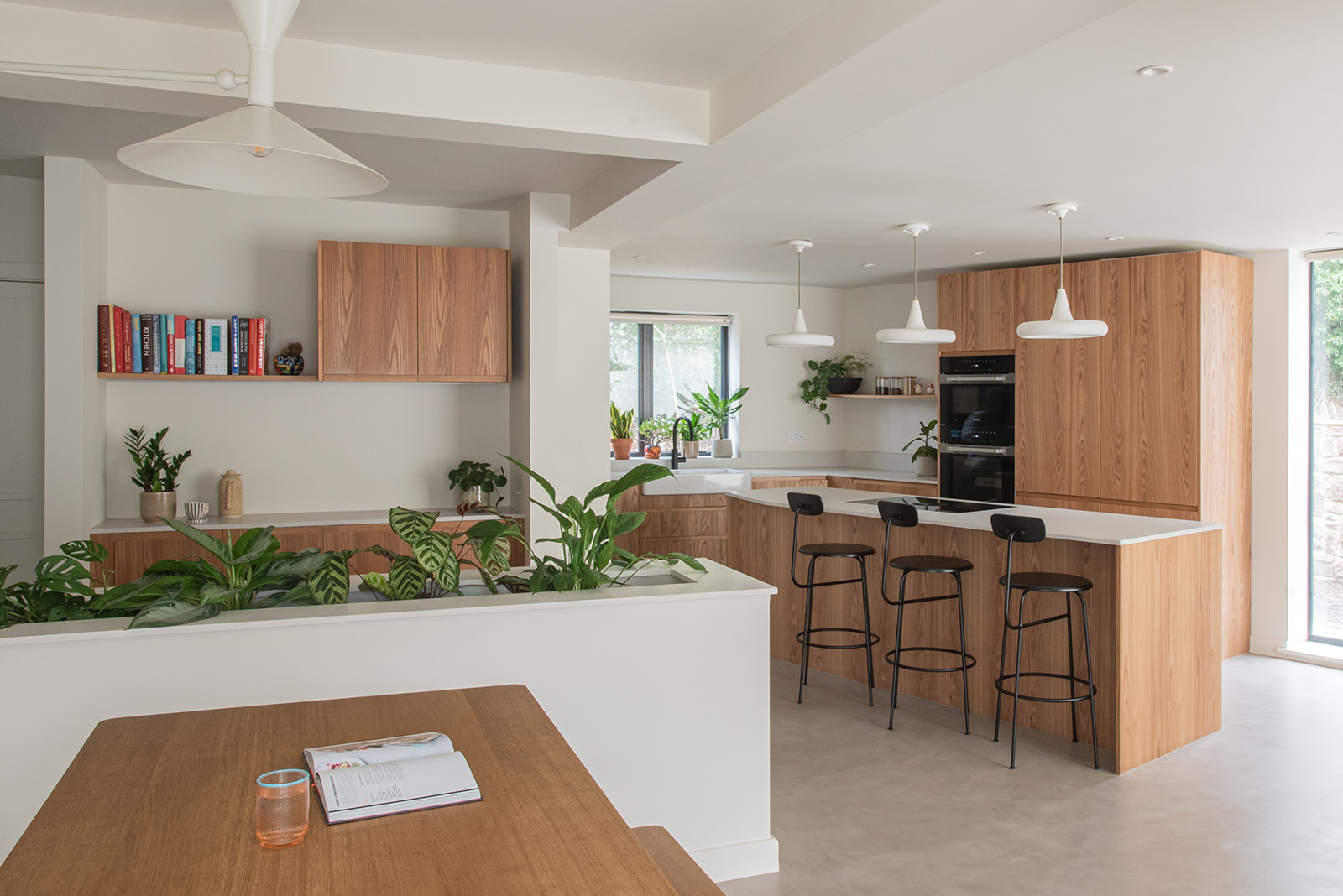 Wood kitchen with dining seating area nearby