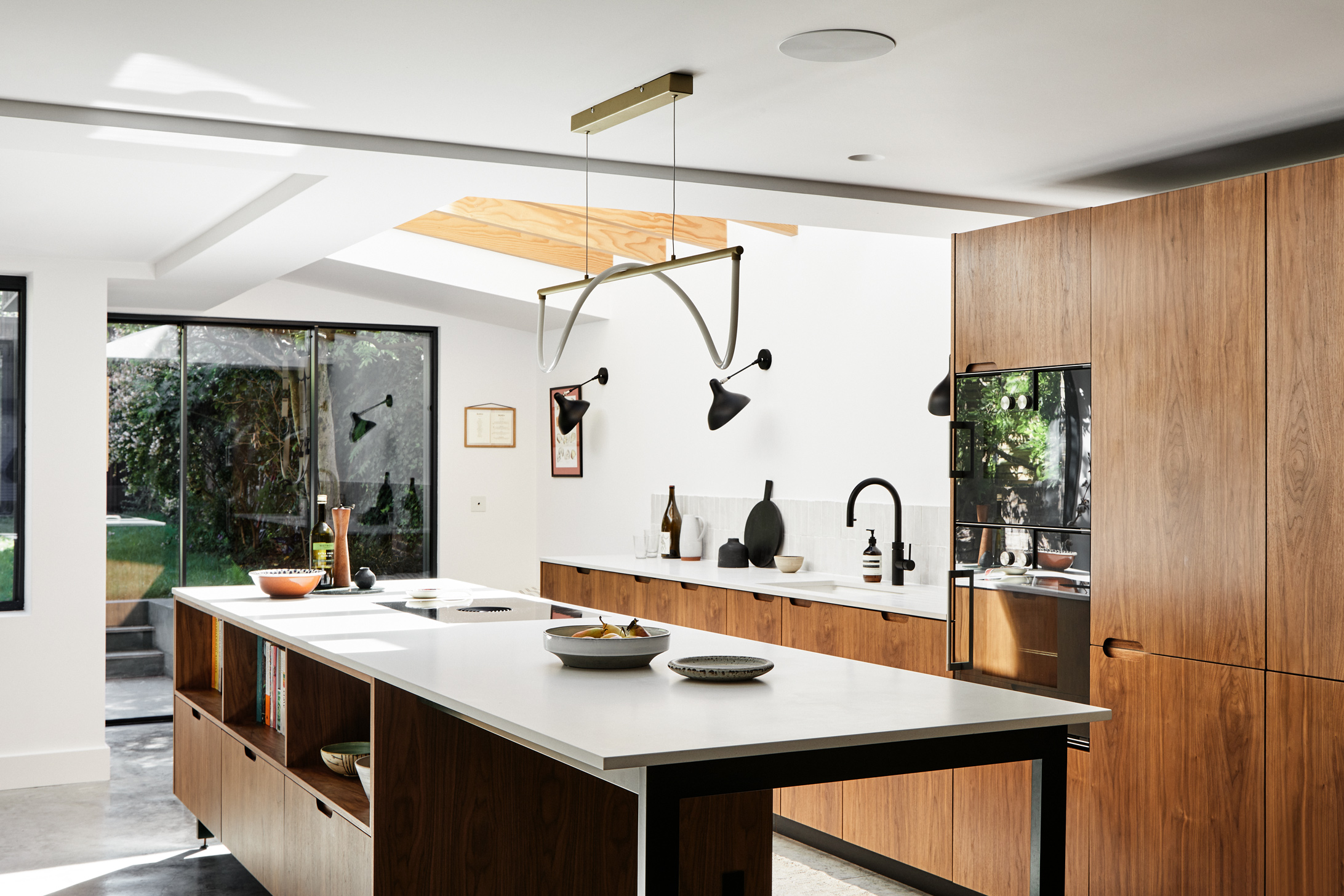 Walnut wooden kitchen with white worktop