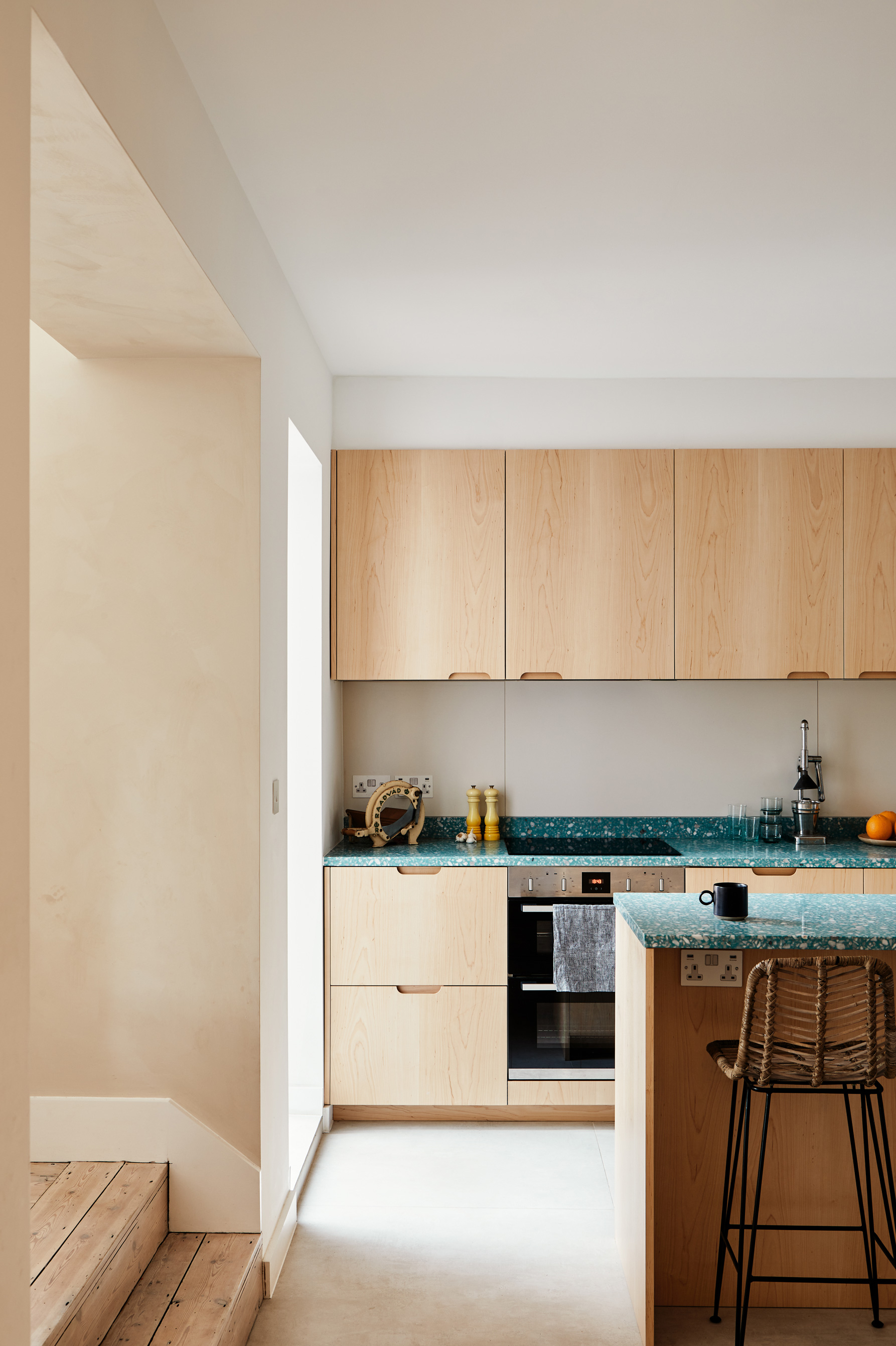 wooden kitchen with white floor and island