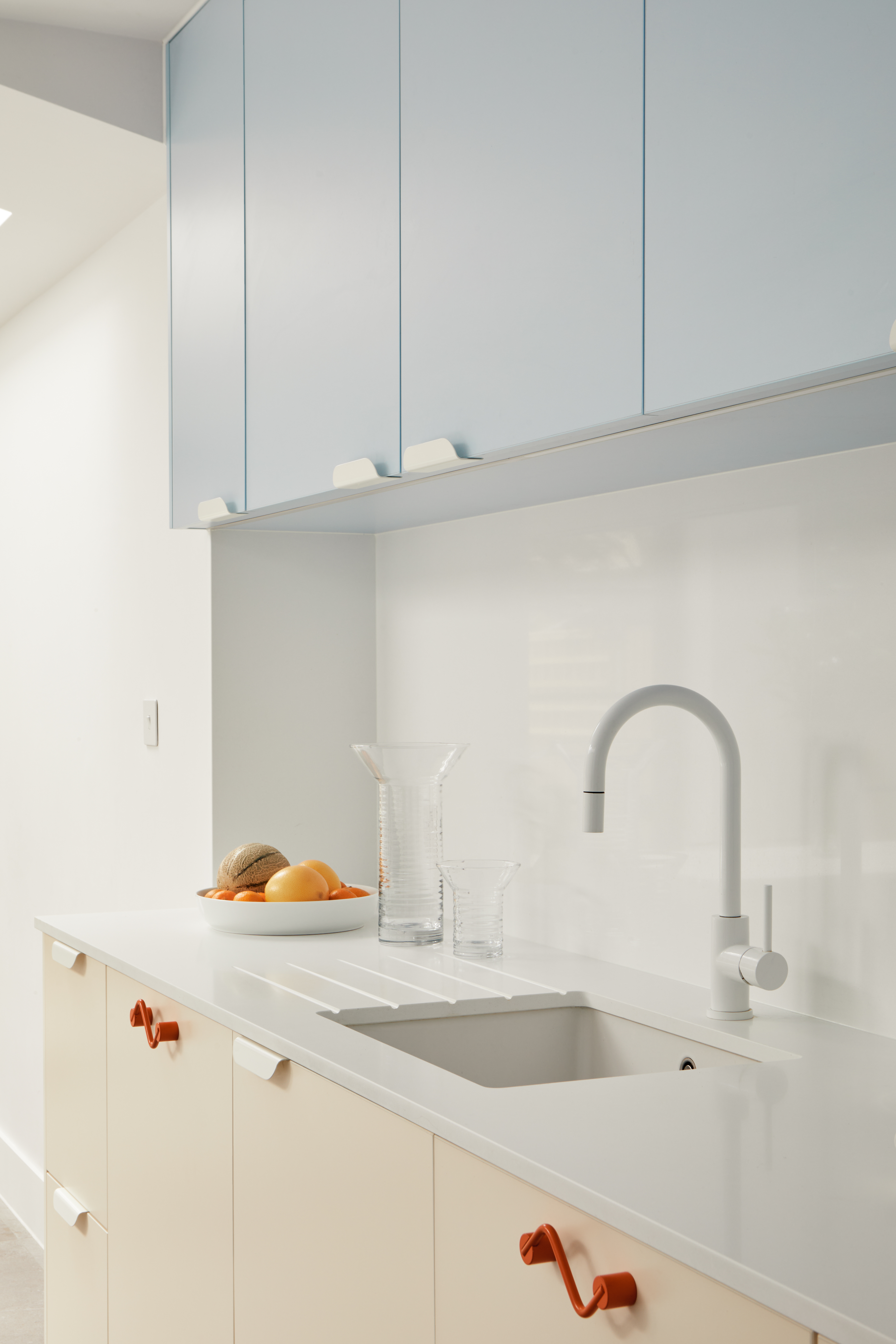 kitchen sink with pale blue and white worktop