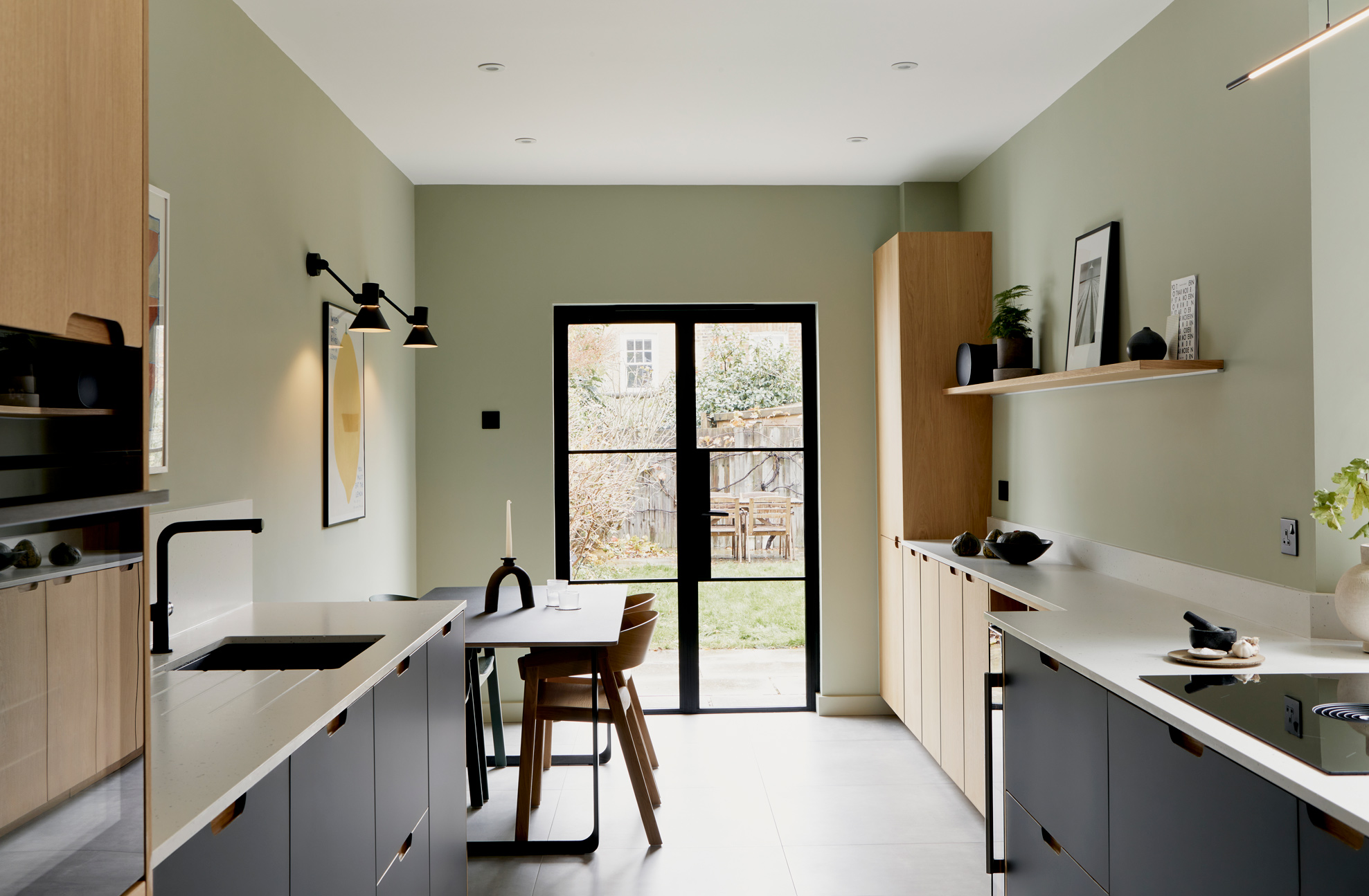 View through kitchen to garden wood fronts and white worktop