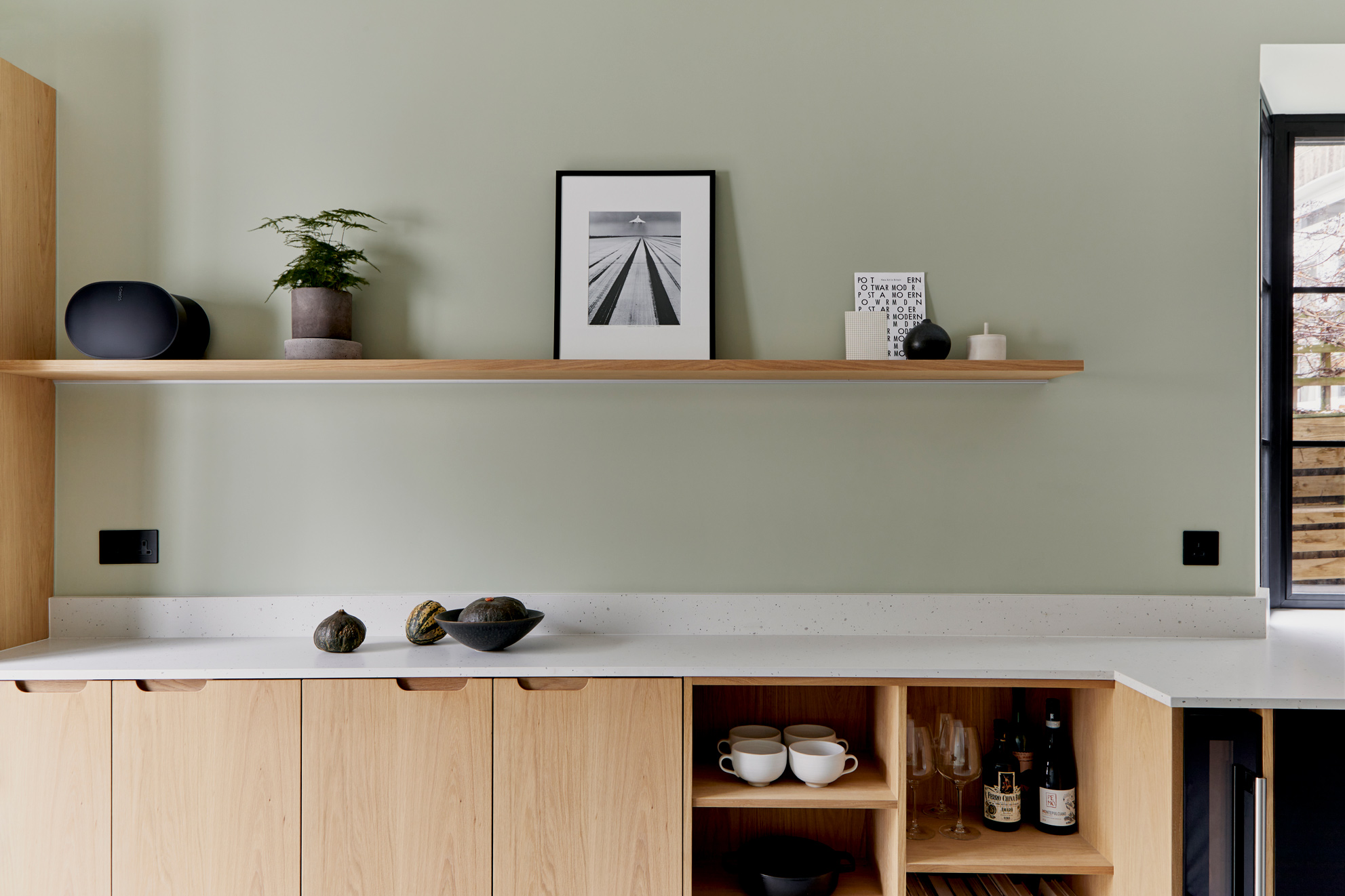 kitchen with wood fronts and white worktop and open shelving