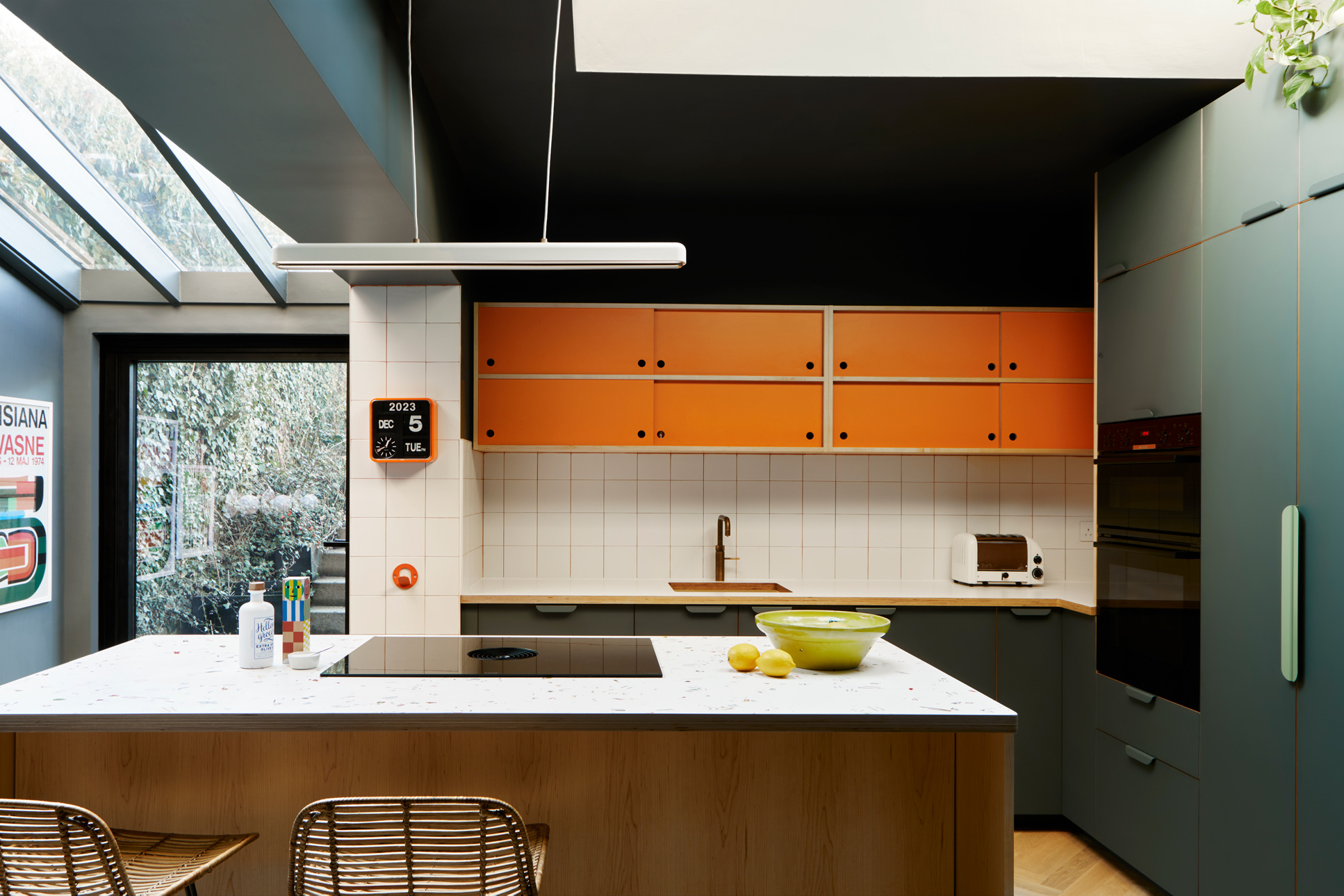 green orange and wood kitchen with kitchen island