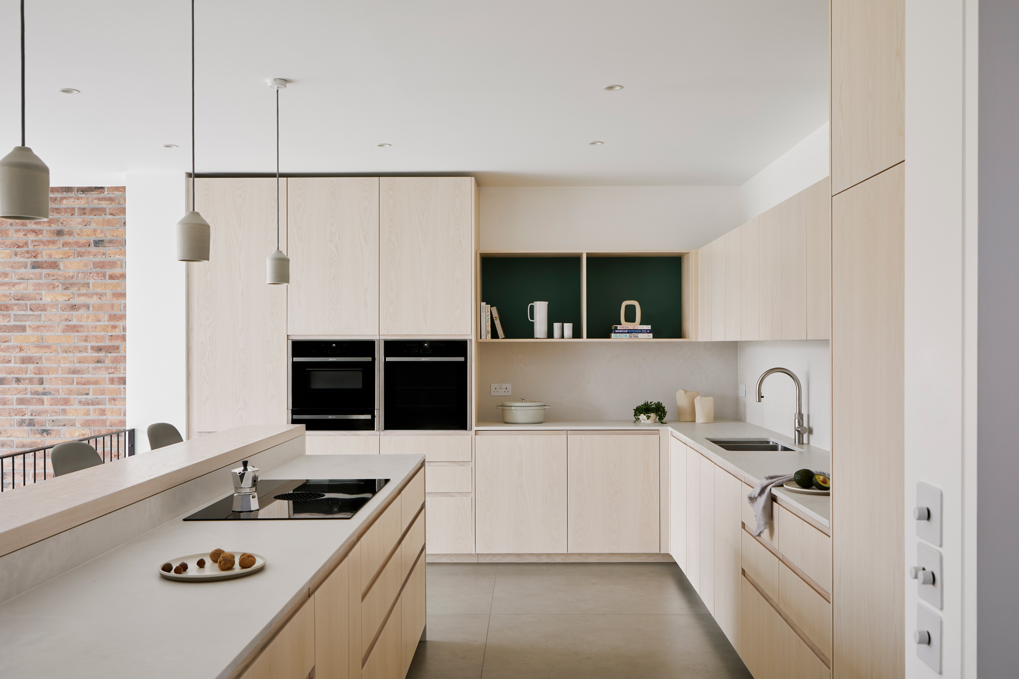 open plan kitchen with wood doors and white worktop