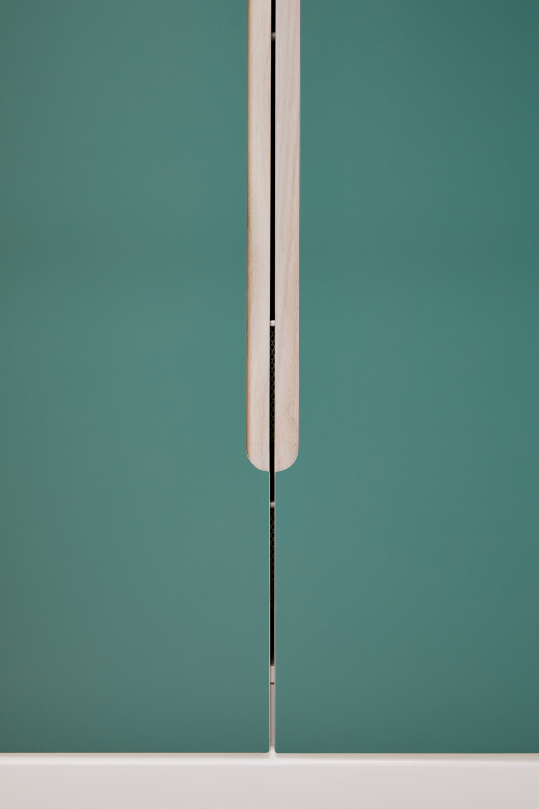 detail of green cabinet doors and handles