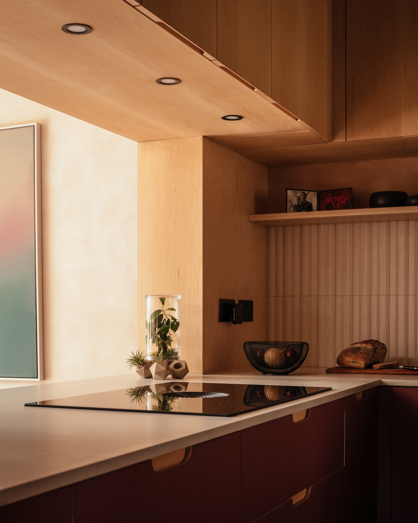 burgungy kitchen cabinet with hob and open hatch