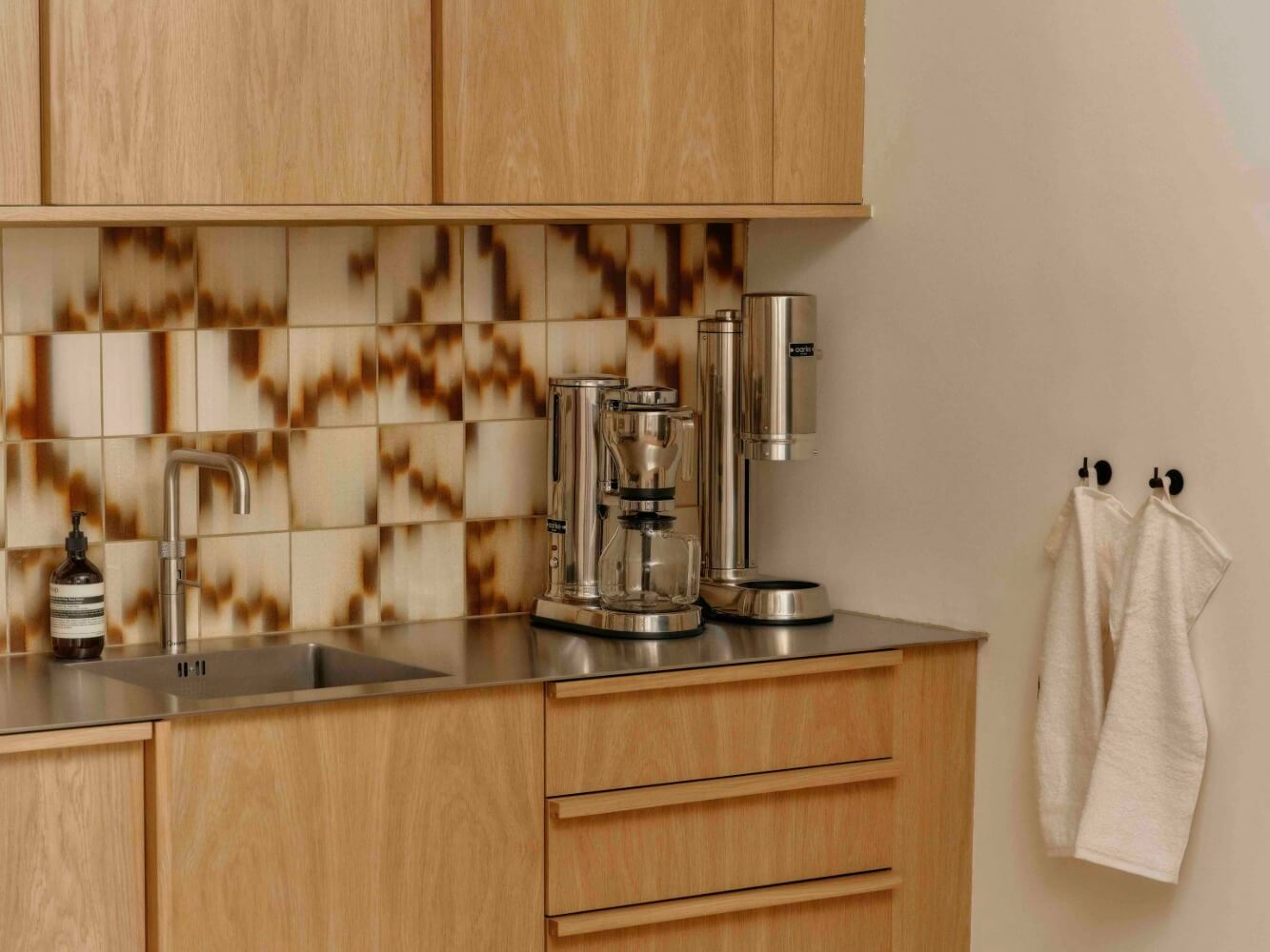 Timber fronts in Oak with matching timber pull handles, with tiles by Palet and coffee station by Aarke