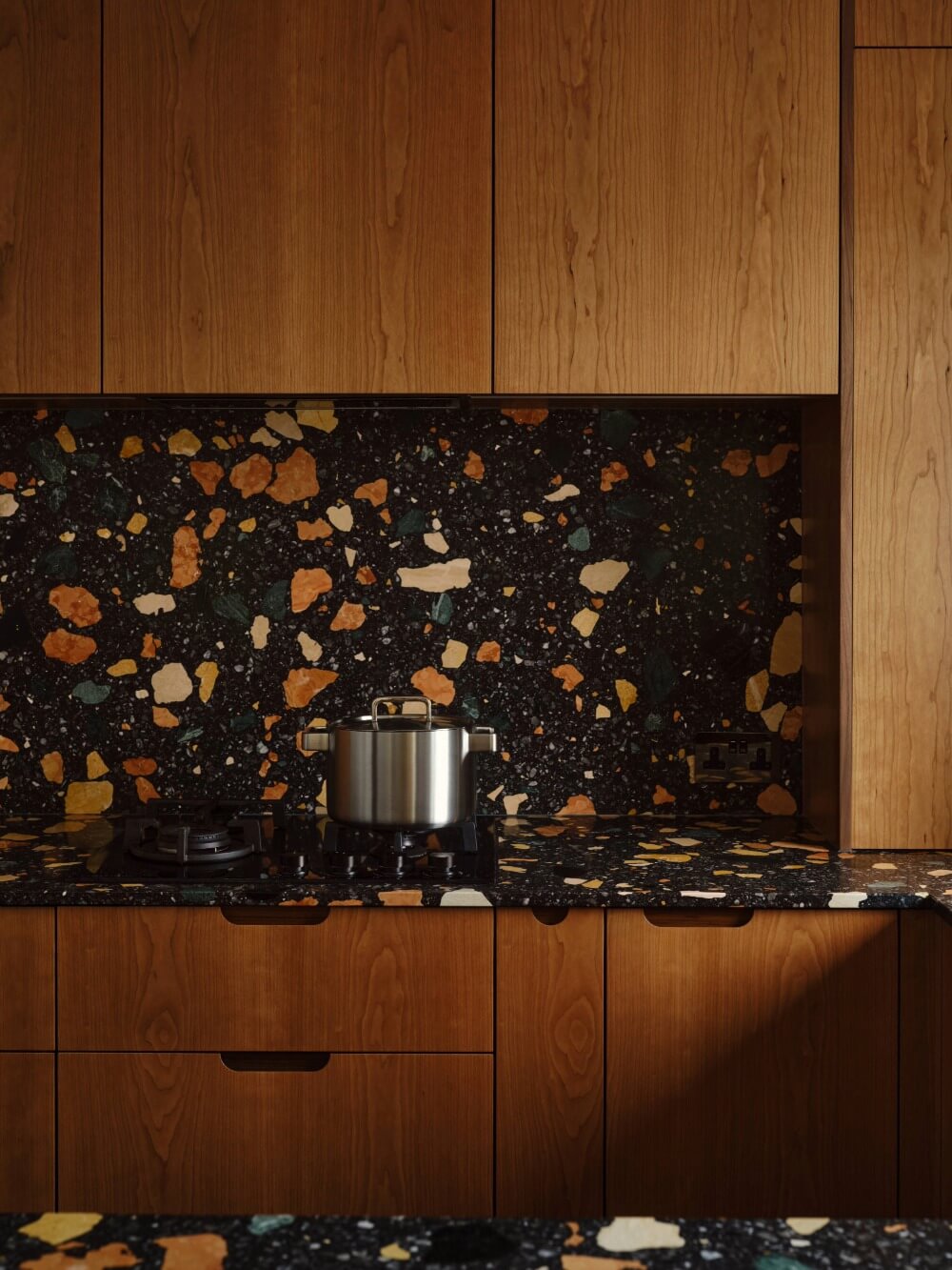Portrait image of Bespoke Kitchen Design Featuring Wood Veneer and Marmoreal worktops